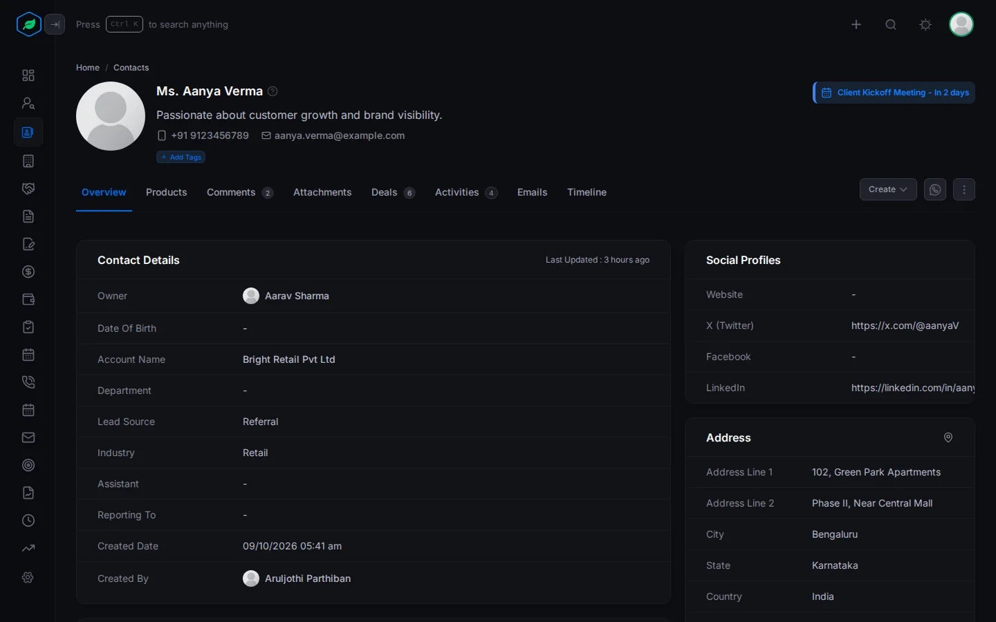 A contact's page: header with name, description, phone and email, the tabs, and the Contact Details, Social Profiles and Address cards